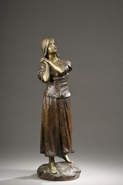 null LARCHE Raoul, 1860-1912
Jeanne d’Arc
bronze à patines médaille et brun-roux...