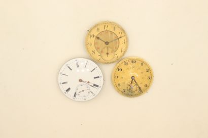 null Set of three gousset watch movements with white enameled dials.