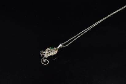 null 18K (750) white gold chain and pendant featuring a stylized peacock feather...