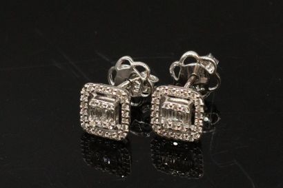 null Pair of 18k (750) white gold square stud earrings set with baguette and round...