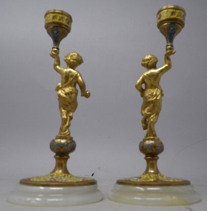 null Pair of small bronze and cloisonné enamel candlesticks featuring a putti with...