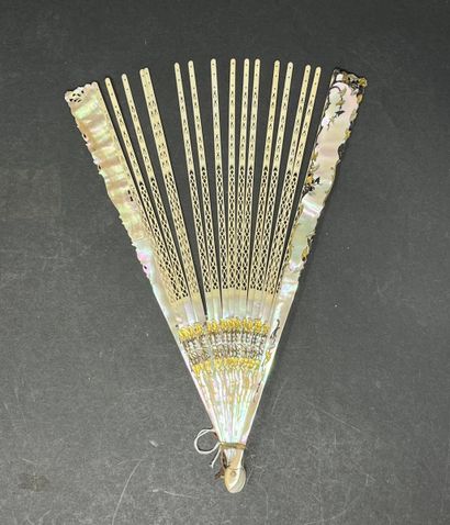 null Four fan mounts, France, circa 1900
One in white mother-of-pearl, two in goldfish...