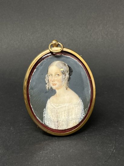 null Oval miniature of a woman in a white dress.
Height: 6.70 cm