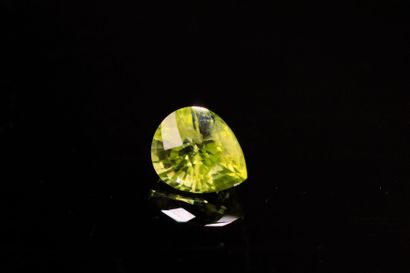 Pear-shaped peridot on paper. 
Weight : 1.31...