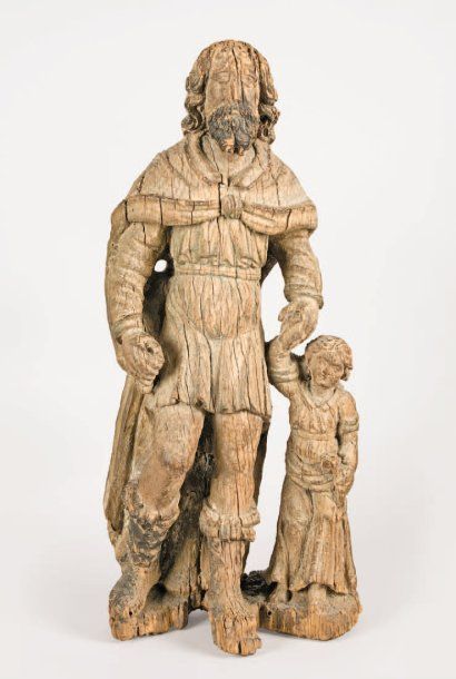 null Sculpture en chêne représentant Saint Joseph et l'Enfant Jésus. Joseph, la tête...