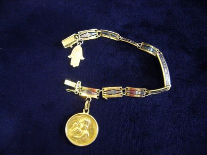 null Bracelet d'identité en or jaune agrémenté d'une médaille religieuse et d'une...