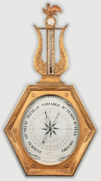 null Baromètre - Thermomètre en bois doré et sculpté à cadran circulaire signé "RIGUET...