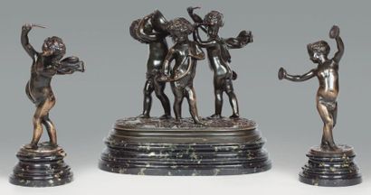 CLODION, Claude Michel dit (1738 -1814) Garniture en bronze à patine noir représentant...