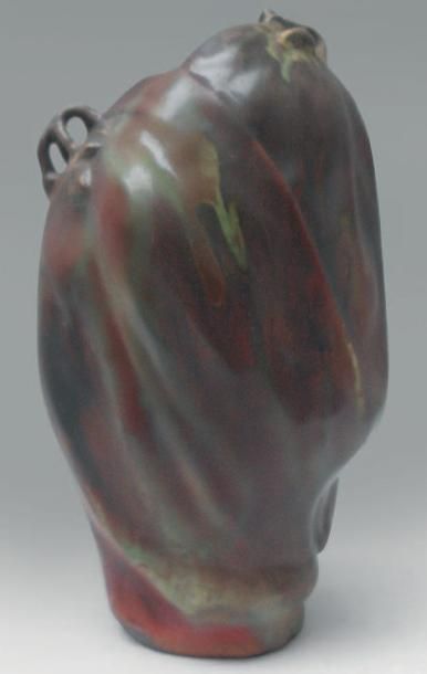 Ernest BUSSIÈRE (1863 -1913) & LUNEVILLE Vase en céramique à corps stylisé de végétal...