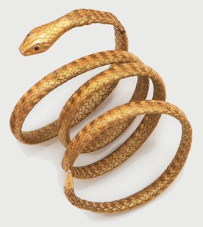 null Bracelet serpent en or jaune tressé à enroulement. (accidents). Poids: 40g