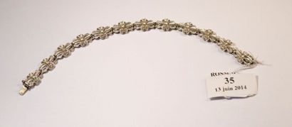 null Bracelet articulé en or gris 18 K ajouré, les maillons à décor de fleurs ornés...