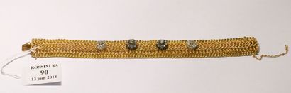 null Bracelet souple en or jaune 18 K, les maillons entrelacés ornés de quatre motifs...