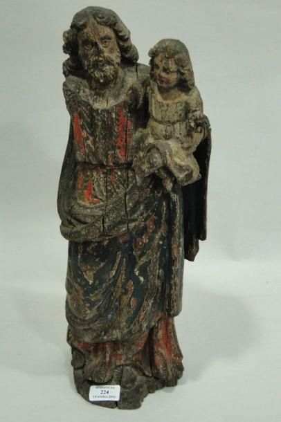 null Saint Joseph et l'Enfant Jésus en chêne sculpté et polychromé. XVIIe siècle....