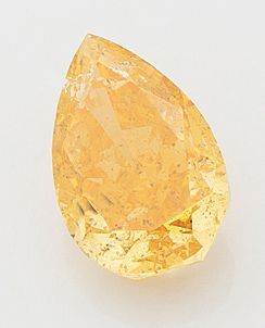 null Diamant non monté taille poire couleur «natural fancy intense yellow orange»...