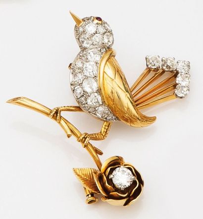 BOUCHERON Broche figurant un oiseau sur une fleur, elle est sertie d'un diamant taille...