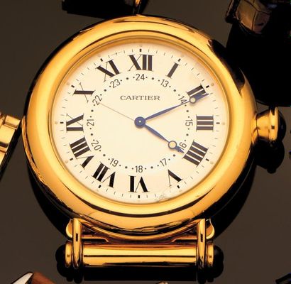 CARTIER Pendulette de bureau en métal doré à la forme d'un cadran de montre, cadran...