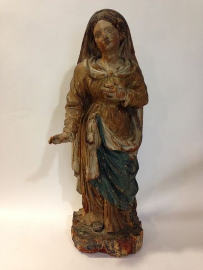 null Sainte Agathe ( ?) en bois sculpté et polychromé. Debout,

la tête inclinée...