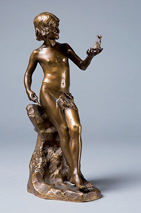 LORIEUX Julien, 1876-1915 
Jeune pâtre sculptant une chèvre
Bronze à patine médaille...