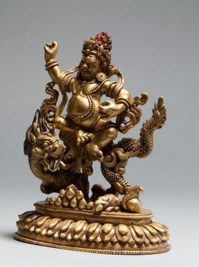 null Sujet en bronze doré représentant Jambhala blanc assis sur le dragon, sur un...