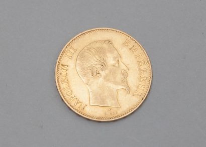 null Une pièce en or 100 Fr "Empire Français" (1857 A).

