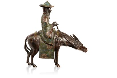 null Sujet en bronze et émaux champlevés polychromes représentant Toba sur sa mule.

Japon,...