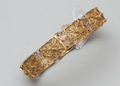 Bracelet en or jaune 18K (750) articulé de...