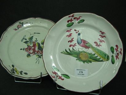 null Deux belles assiettes -décor "au paon" Faience de l'est (un éclat restauré)...