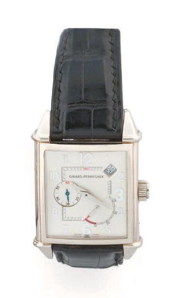 GIRARD PERREGAUX. Grande montre d'homme rectangulaire galbée en or gris 18 k (750...