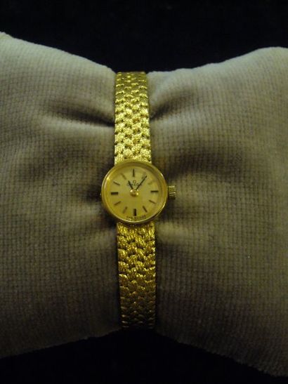 null Montre bracelet de dame en or jaune de marque OMEGA. Poids brut : 28,2 g