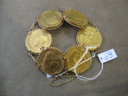 null Bracelet en or jaune formé de six pièces en or diverses. Poids : 53g.