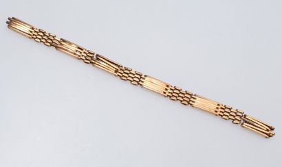 null Débris d'un bracelet en or jaune 18k (750).

Poids : 16.9 g.