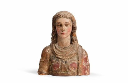 Buste de femme en bois sculpté et polychromé.
Visage...