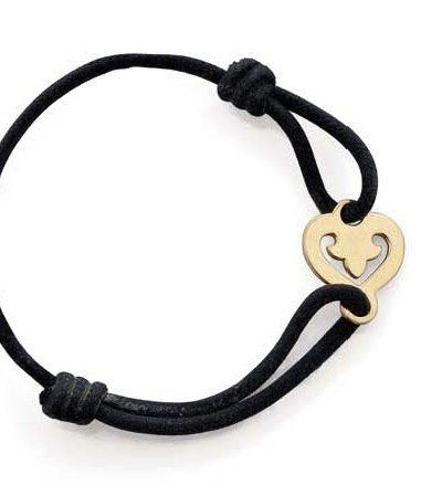 O.J. PERRIN Bracelet formé d'un coeur stylisé, tour de poignet en cordelette noire....