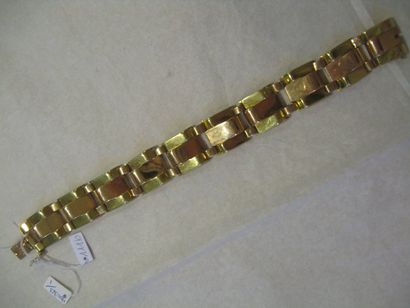 null Bracelet genre tank en or jaune et or rose. Poids : 39,5 g - Long : 21cm.