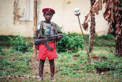 Patrick Robert (né en 1958) Enfant soldat du groupe rebelle LPC, Libéria, Monrovia,...