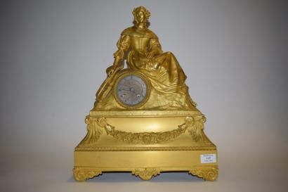 null Pendule en bronze doré à décor d'une femme assise, une cythare à sa droite,...