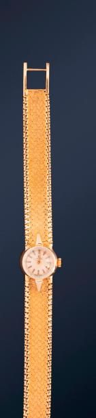 Montre bracelet de dame à quartz en or jaune 18K (750) à boitier rond, le bracelet...