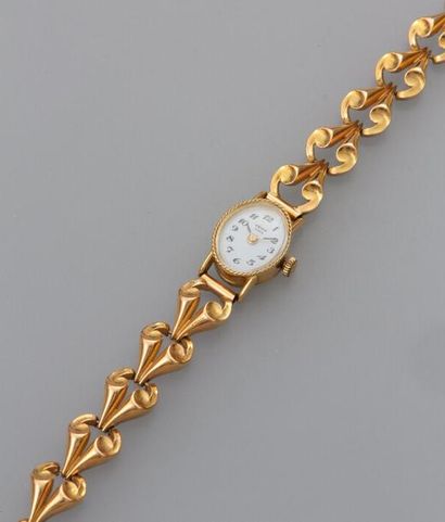 null Montre bracelet de dame en or jaune 18k (750). Cadran blanc à chiffres arabes...