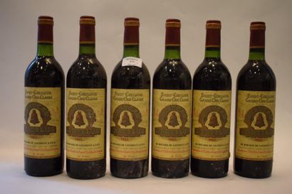 null 6 bouteilles CH. ANGELUS, 1° Grand cru St-Emilion 1982 (es, 3 J) 	

