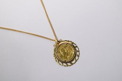null Pièce de 20 Francs Suisse, 1935, montée en pendentif avec sa chaîne en or (18K).

Poids...