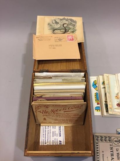 null Une boite en bois de cartes postales anciennes diverses. 