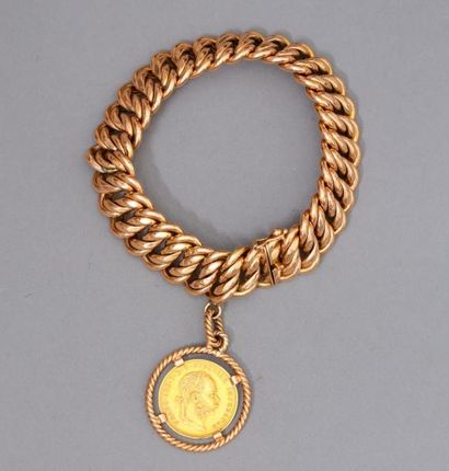 null Bracelet en or jaune 18k (750 à maille américaine orné d'un souverain en or...