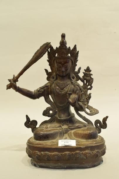 null Sujet en alliage de cuivre représentant le dieu Manjusri assis en méditation,...