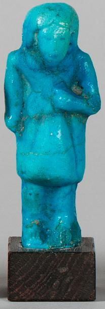 null Ouschebti 

représentant un buste de contre-maître en frite émaillée bleue.

Egypte,...