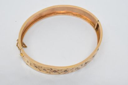 null Bracelet ruban articulé en or jaune 18k (750) orné dans sa partie supérieure...