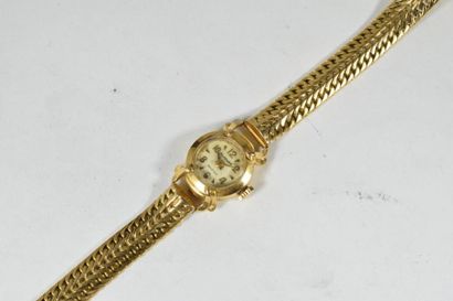 null Montre bracelet de dame en or jaune 18k (750), cadran rond à fond crème, chiffres...