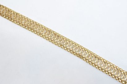 null Bracelet en or jaune 18k (750) à mailles ajourées de style oriental. 

Poids...