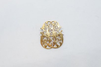 null Broche or jaune 18k (750) chiffrée "JL". 

Epingle en métal.

Poids brut : 5.44...