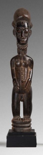 null Statuette masculine Baoulé, finement sculptée. 

Période 1940/1950. 



