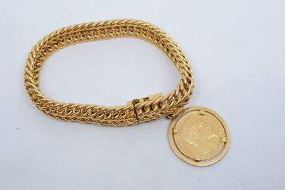 null Pièce de 20 francs Napoléon III (1853 A) retenue par un bracelet en métal. ...